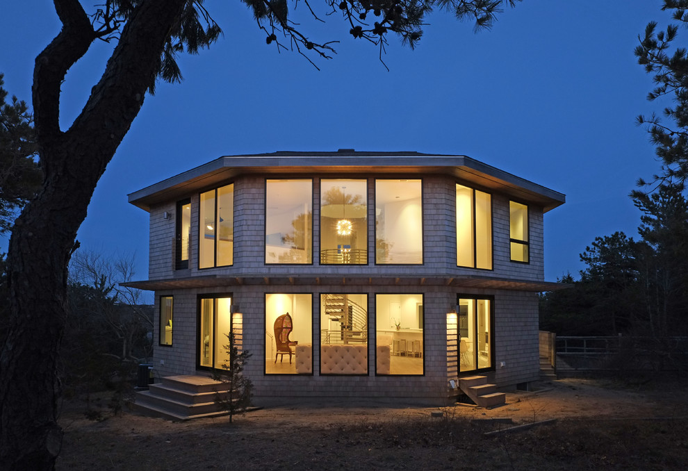 Inspiration for a large contemporary two-storey brown house exterior in Boston with wood siding, a hip roof and a shingle roof.