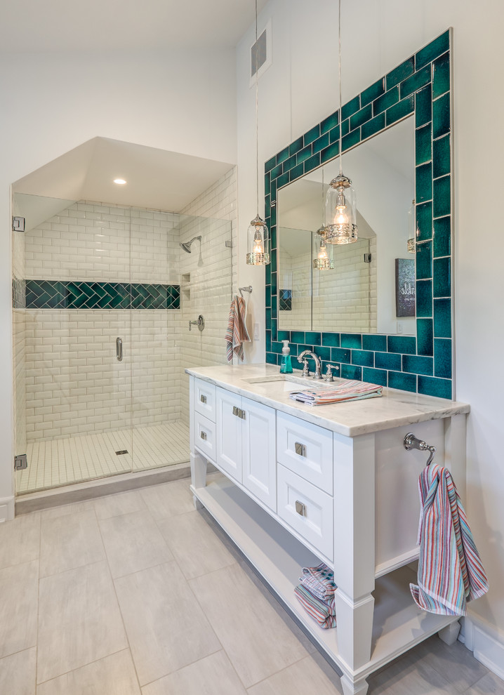 Inspiration for a mid-sized transitional master bathroom in Indianapolis with flat-panel cabinets, grey floor, white cabinets, green tile, subway tile, a freestanding tub, an alcove shower, a two-piece toilet, white walls, porcelain floors, an undermount sink, a sliding shower screen, quartzite benchtops and white benchtops.