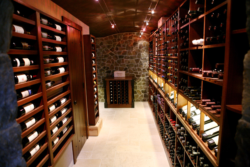 Photo of a traditional wine cellar in Other with display racks.