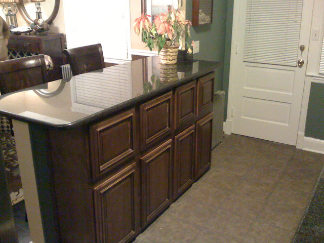 Inspiration for a transitional kitchen remodel in DC Metro with beaded inset cabinets, dark wood cabinets and granite countertops