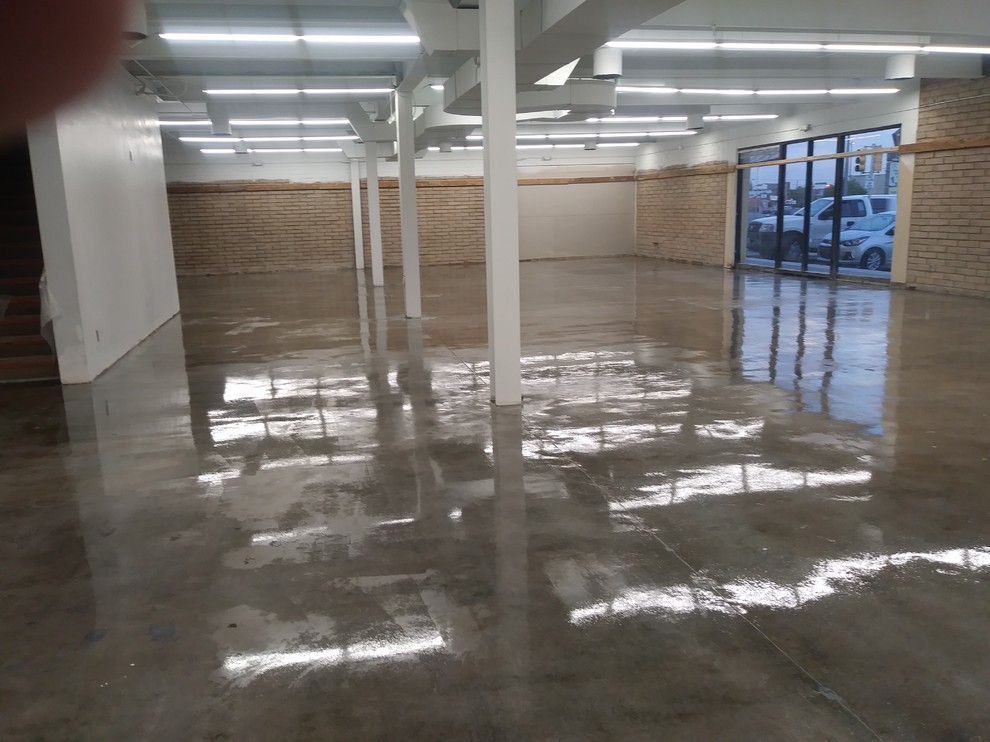 Example of a large mountain style concrete floor entry hall design in Albuquerque