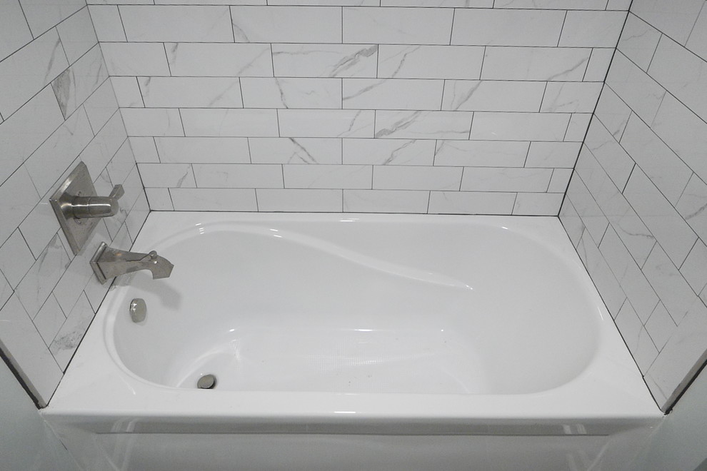Inspiration for a mid-sized transitional kids' white tile and porcelain tile porcelain tile and gray floor alcove bathtub remodel with shaker cabinets, gray cabinets, a two-piece toilet, green walls, an undermount sink, quartz countertops and white countertops