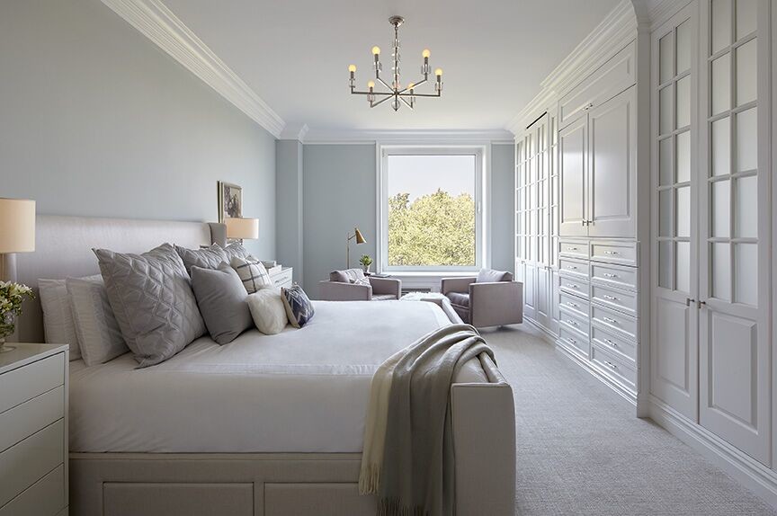 Large transitional master bedroom in New York with grey walls, carpet and no fireplace.