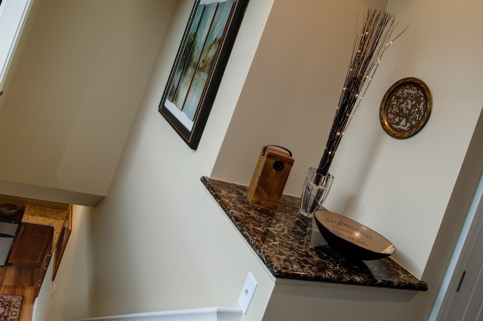 Inspiration for a small transitional medium tone wood floor hallway remodel with beige walls