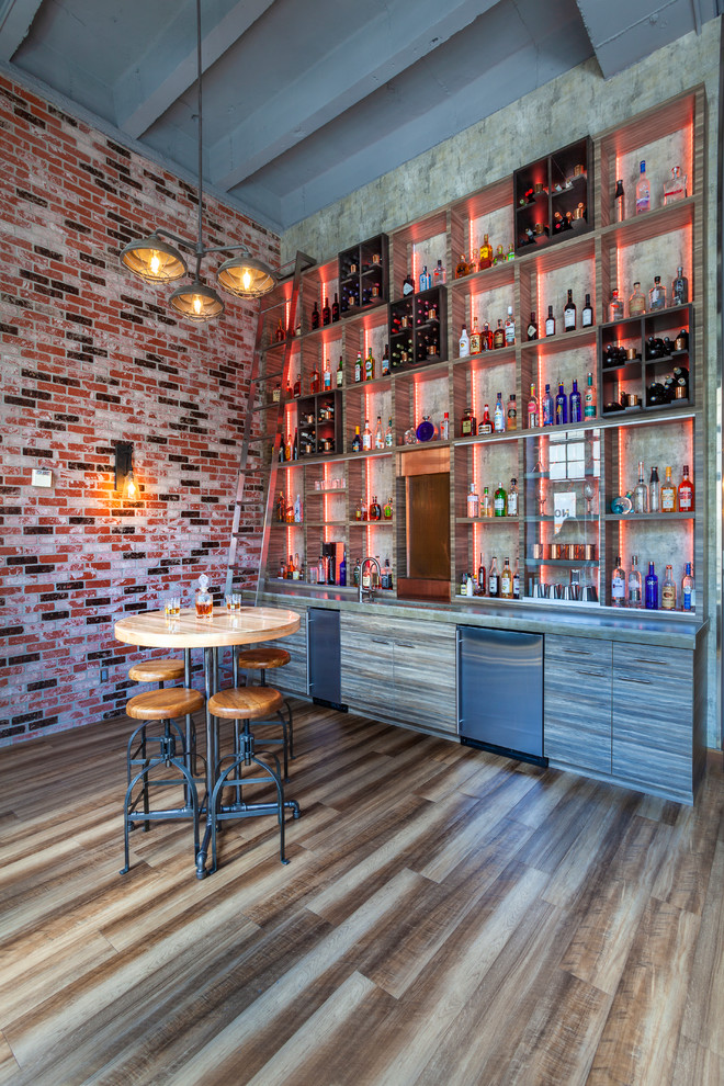 Design ideas for an industrial single-wall seated home bar in Seattle with open cabinets.