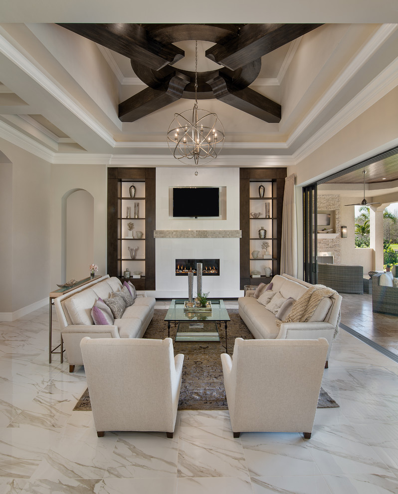 This is an example of a mid-sized contemporary formal open concept living room in Miami with beige walls, a ribbon fireplace, a built-in media wall and white floor.