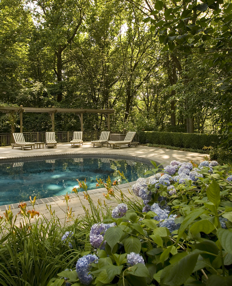 This is an example of a traditional backyard shaded garden in New York.