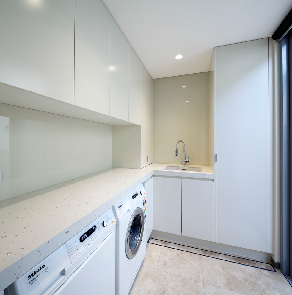 Photo of a contemporary laundry room in Sydney.