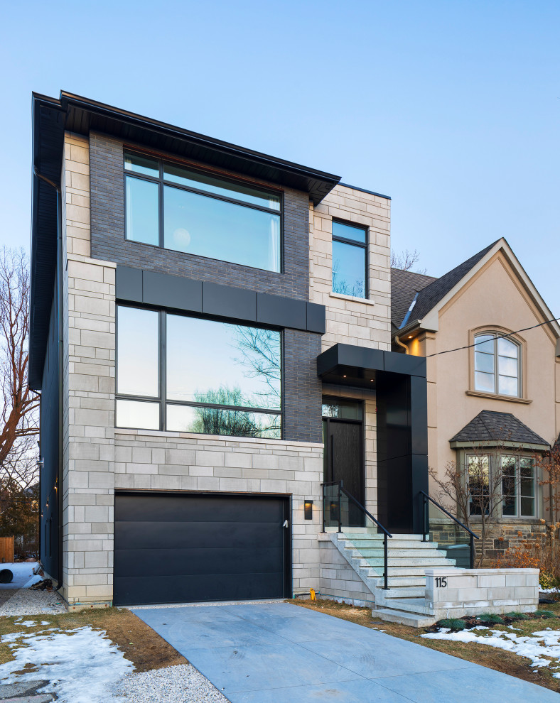 This is an example of a mid-sized contemporary two-storey brick white house exterior in Toronto with a hip roof and a shingle roof.