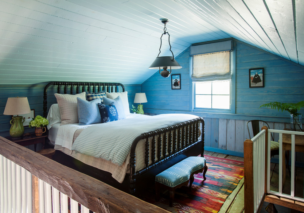 Country loft-style bedroom in Atlanta with blue walls.