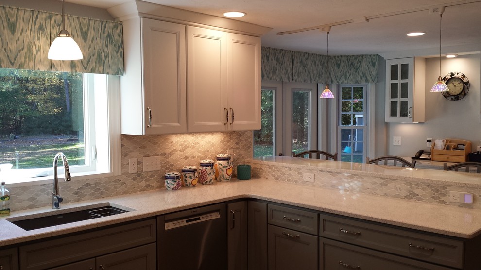 Kitchen - mid-sized transitional u-shaped light wood floor kitchen idea in Boston with an undermount sink, quartz countertops, stainless steel appliances and a peninsula