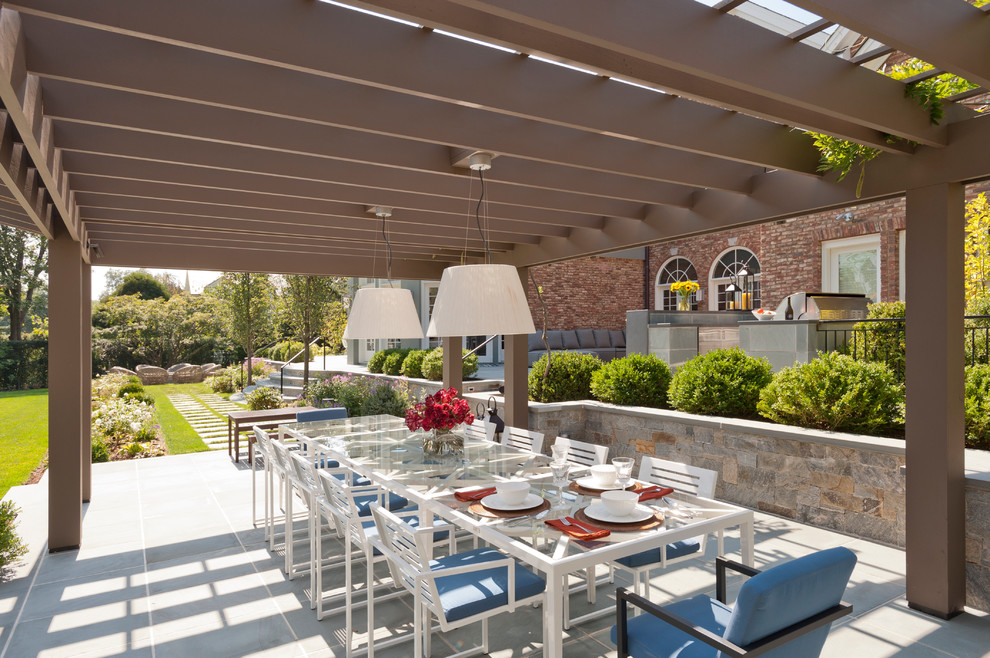 Design ideas for a beach style patio in New York with a pergola.