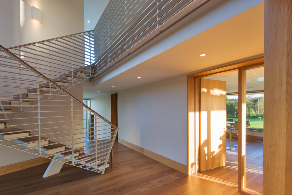 Inspiration for an expansive contemporary hallway in Cork with light hardwood floors.