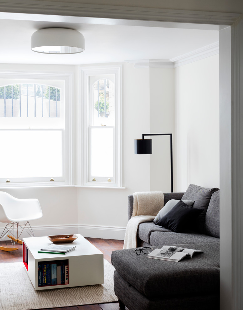 This is an example of a medium sized contemporary formal open plan living room in London.