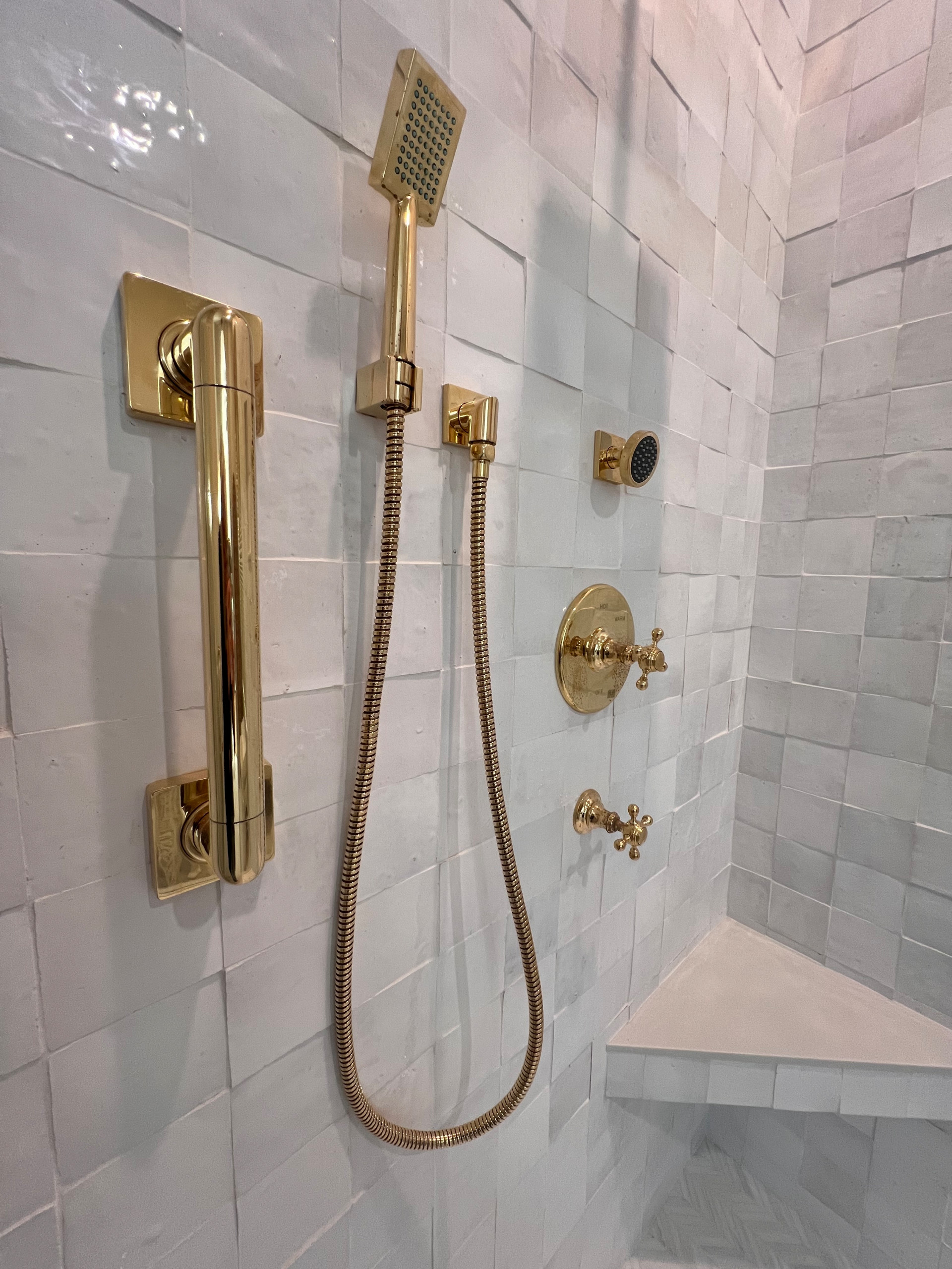 Glowing Solid Brass Plumbing Fixtures & Grab Bar by Newport Brass