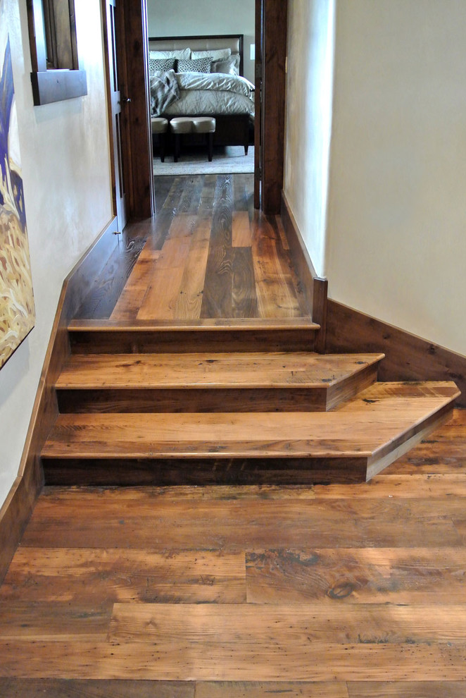 Design ideas for a mid-sized traditional hallway in Cleveland with white walls and dark hardwood floors.