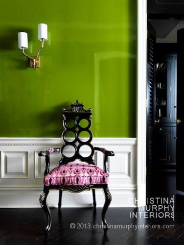 Design ideas for a traditional hallway in New York with green walls and dark hardwood floors.