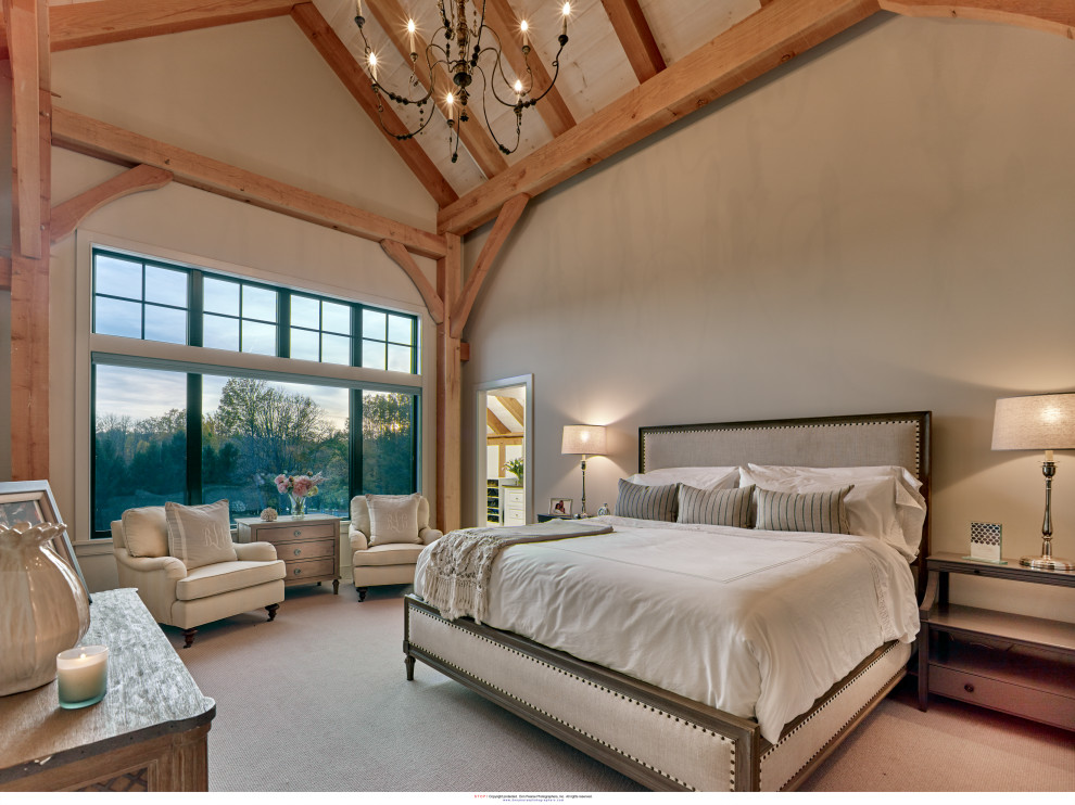 На фото: хозяйская спальня среднего размера в стиле кантри с бежевыми стенами, ковровым покрытием, бежевым полом и сводчатым потолком