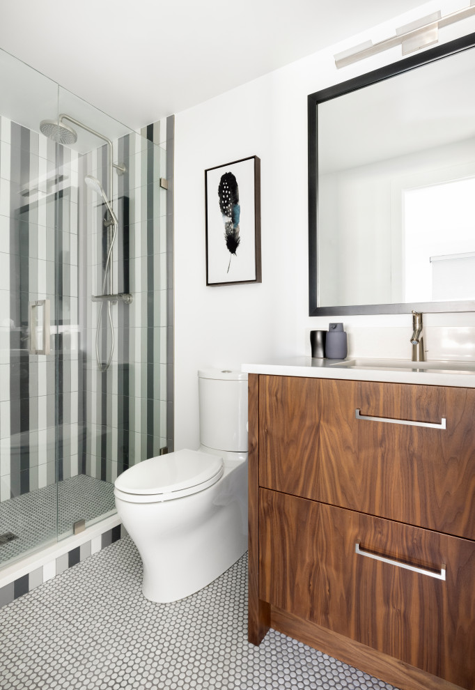 Example of a mid-sized trendy 3/4 white tile and porcelain tile single-sink bathroom design in Denver with flat-panel cabinets, medium tone wood cabinets, quartz countertops, white countertops and a one-piece toilet