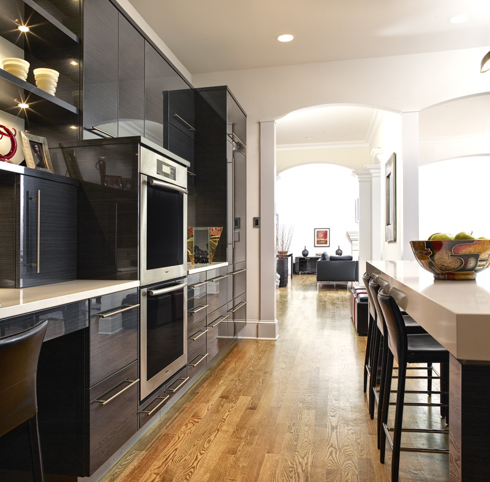 Inspiration for a contemporary kitchen in Philadelphia with flat-panel cabinets and black cabinets.