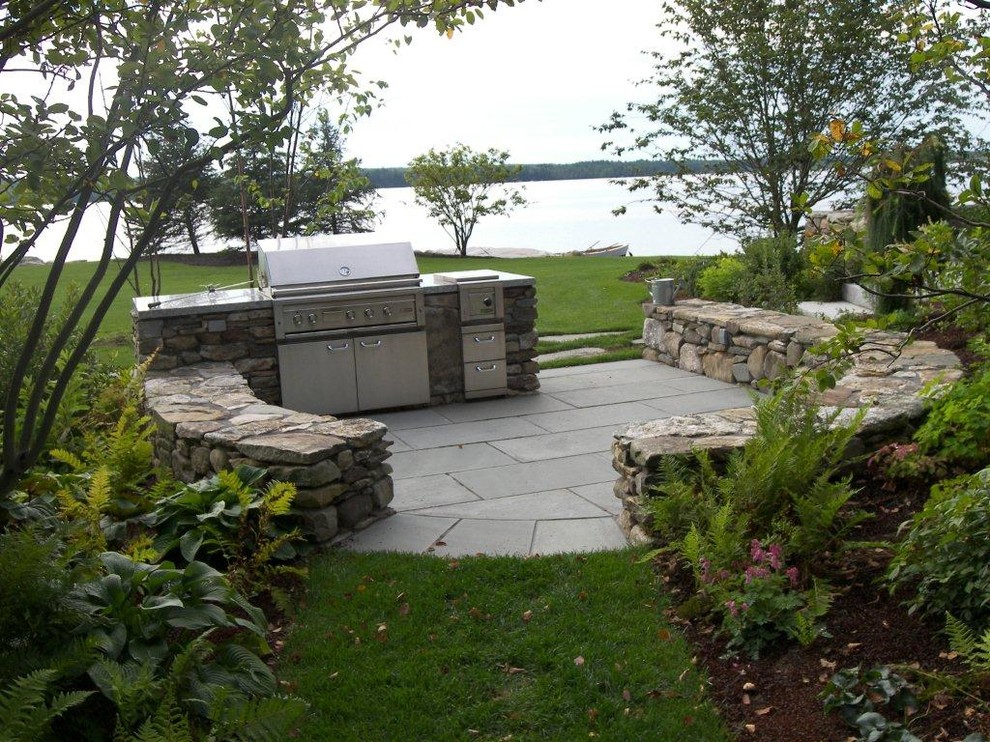 Mid-sized traditional backyard patio in Portland Maine with an outdoor kitchen, concrete pavers and no cover.