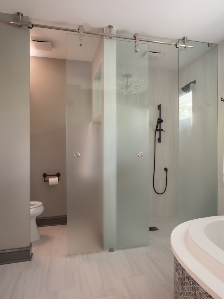 Photo of a large modern ensuite bathroom in Atlanta with flat-panel cabinets, brown cabinets, a two-piece toilet, porcelain tiles, grey walls, porcelain flooring, a submerged sink, engineered stone worktops, a sliding door, white worktops, a shower bench, double sinks and a built in vanity unit.