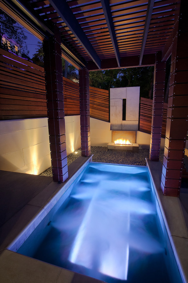 Contemporary rectangular pool in Kansas City with a hot tub.