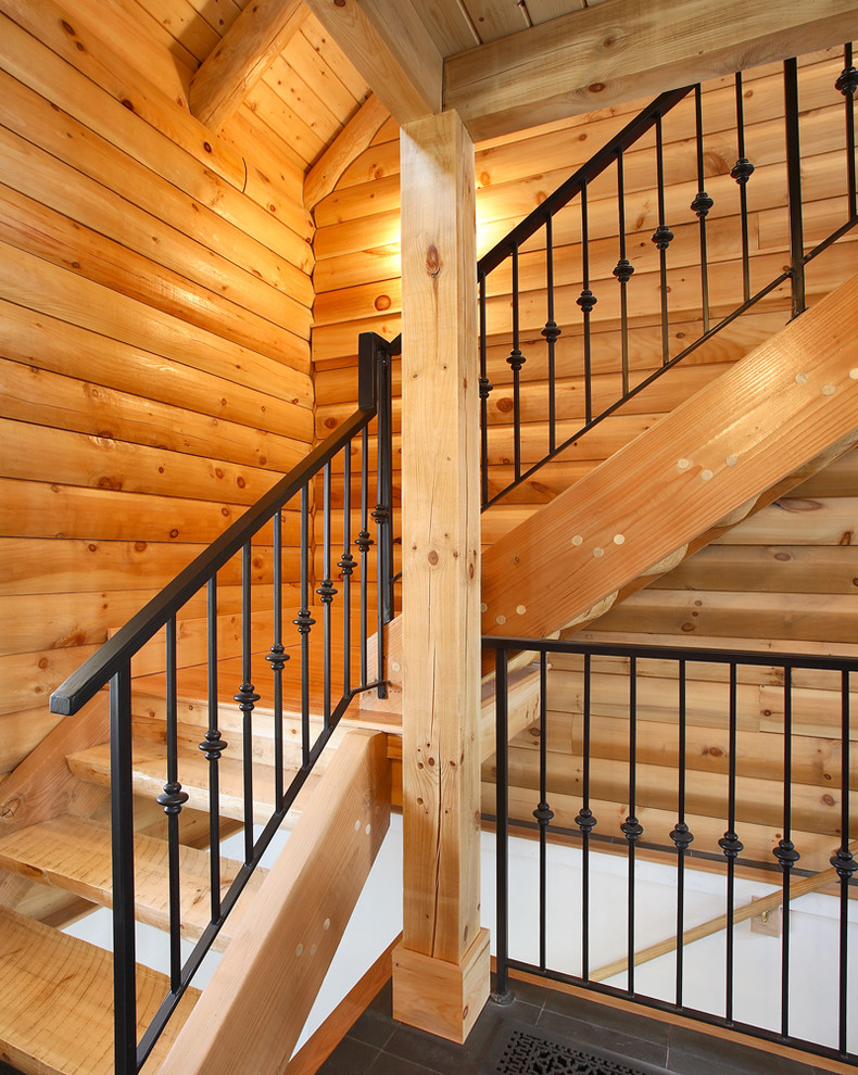 This is an example of a mid-sized country wood l-shaped staircase in Boston with open risers.