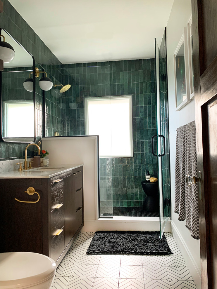 Inspiration for a medium sized contemporary bathroom in Chicago with dark wood cabinets, a corner shower, a one-piece toilet, green tiles, porcelain tiles, white walls, porcelain flooring, engineered stone worktops, black floors, a hinged door, a single sink and a freestanding vanity unit.