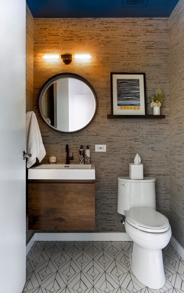 Inspiration for a small contemporary powder room in Chicago with flat-panel cabinets, medium wood cabinets, multi-coloured walls, ceramic floors, engineered quartz benchtops, white floor and white benchtops.
