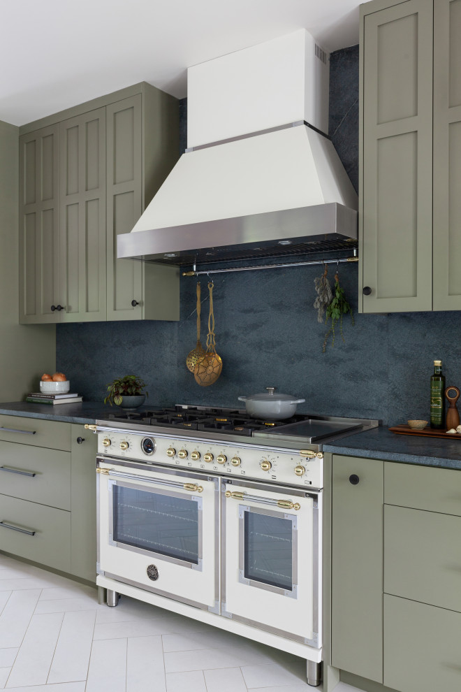 Photo of a retro single-wall kitchen/diner in Other with green cabinets, soapstone worktops, grey splashback, stone slab splashback, white appliances, multiple islands, white floors and grey worktops.