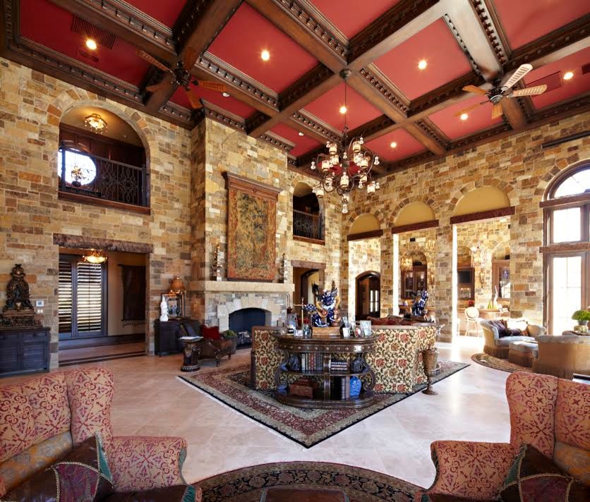 Inspiration for a large arts and crafts open concept living room in Austin with a standard fireplace, a brick fireplace surround, beige walls and limestone floors.