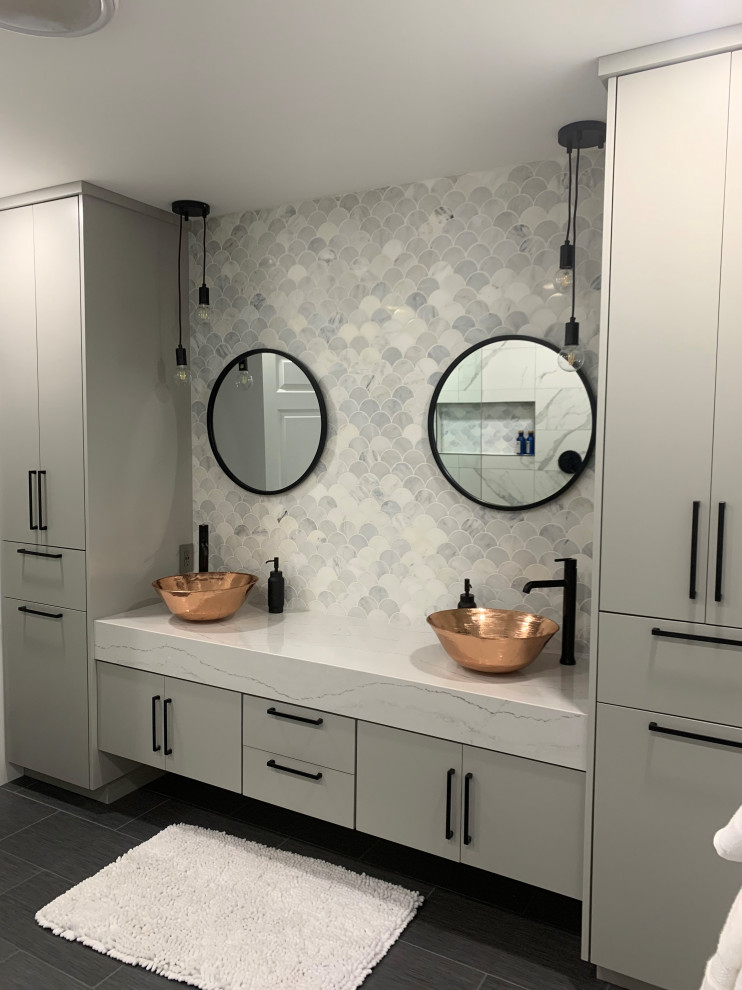 This is an example of a large modern master bathroom in Other with flat-panel cabinets, grey cabinets, a double shower, ceramic tile, white walls, porcelain floors, a vessel sink, engineered quartz benchtops, grey floor, white benchtops, an open shower, a two-piece toilet, multi-coloured tile, a niche, a double vanity and a floating vanity.