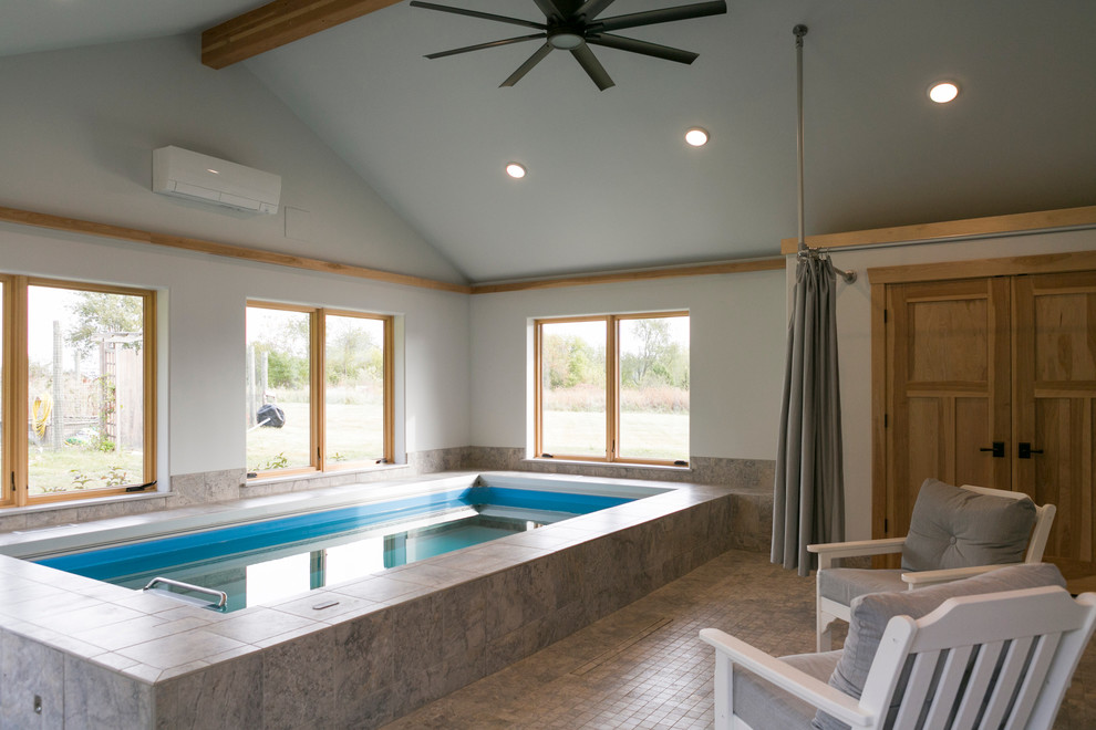 Pool house - mid-sized transitional indoor tile and rectangular lap pool house idea