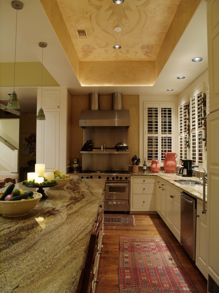 Design ideas for a traditional kitchen in Austin with a double-bowl sink, raised-panel cabinets and white cabinets.