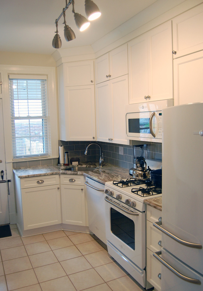 Kitchen - small transitional kitchen idea in Baltimore with a drop-in sink, flat-panel cabinets, white cabinets and an island