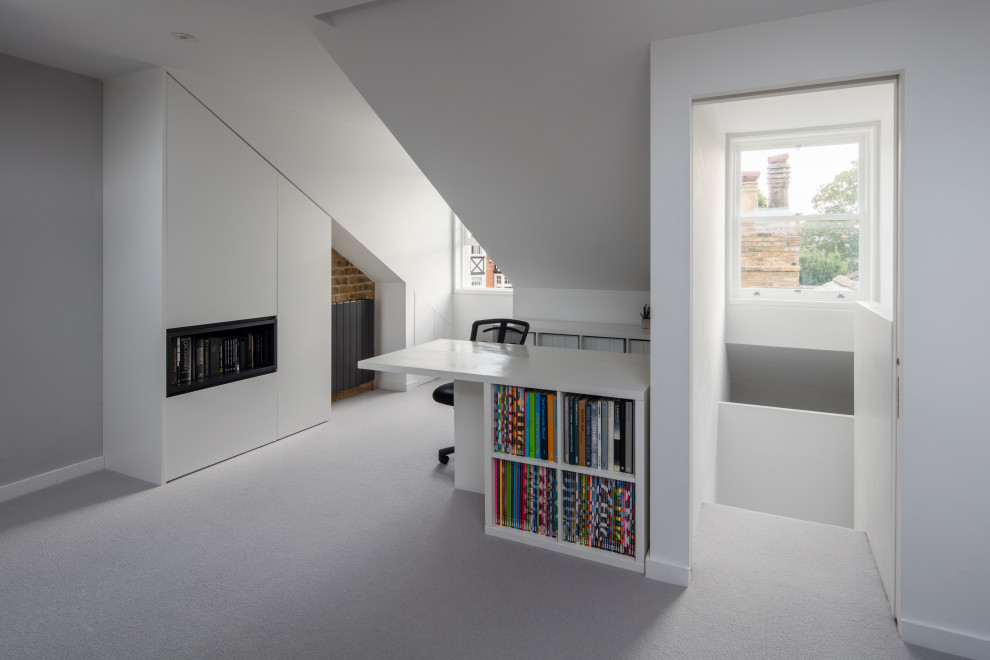 Photo of a modern study room in Surrey with white walls, carpet, a freestanding desk and grey floor.
