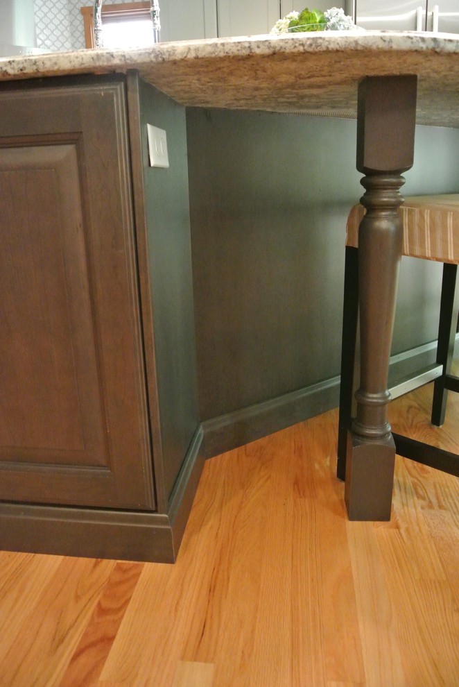 Eat-in kitchen - large transitional l-shaped light wood floor eat-in kitchen idea in Boston with a farmhouse sink, granite countertops, shaker cabinets, gray cabinets, white backsplash, ceramic backsplash, stainless steel appliances, an island and gray countertops