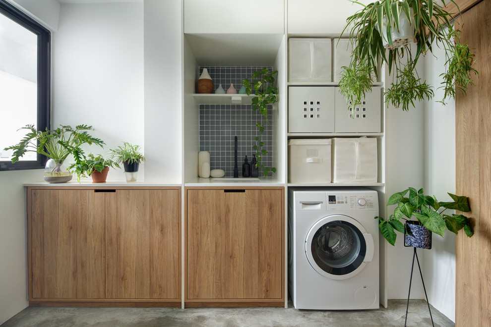 Inspiration for a scandinavian laundry room in Singapore.