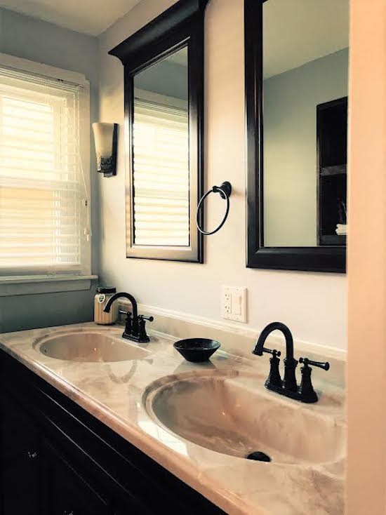Inspiration for a mid-sized transitional gray tile, white tile and ceramic tile ceramic tile and beige floor tub/shower combo remodel in Phoenix with black cabinets, beige walls, granite countertops and an integrated sink