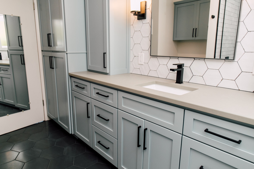 Bathroom - small eclectic white tile and ceramic tile porcelain tile, black floor and single-sink bathroom idea in Seattle with shaker cabinets, blue cabinets, a two-piece toilet, white walls, an undermount sink, quartz countertops, a hinged shower door, gray countertops and a built-in vanity