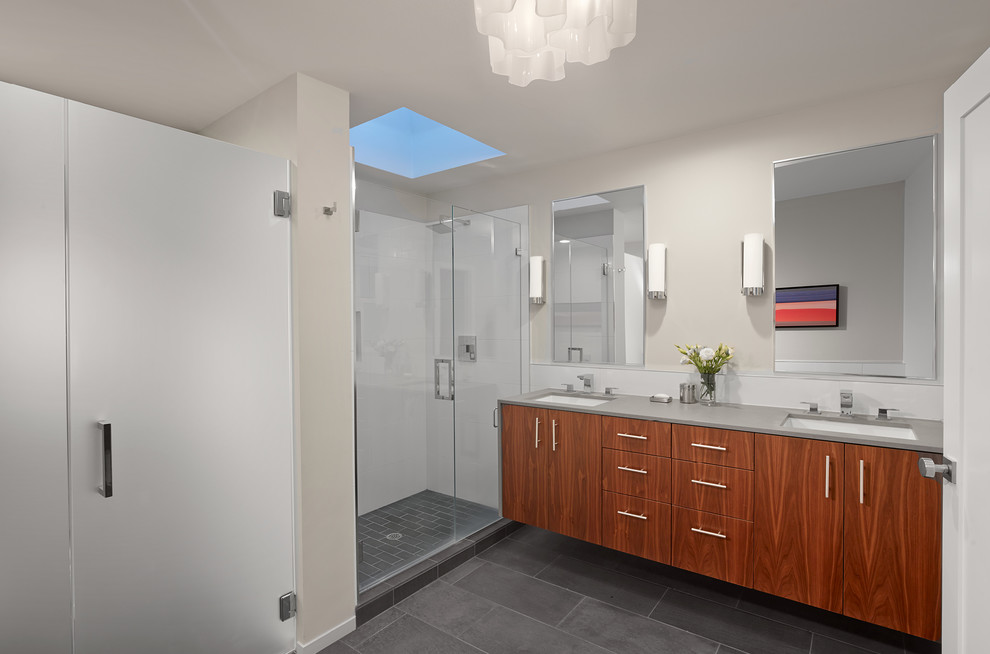 Large contemporary bathroom in San Francisco with an undermount sink, flat-panel cabinets, medium wood cabinets, white tile, grey walls, slate floors and an alcove shower.