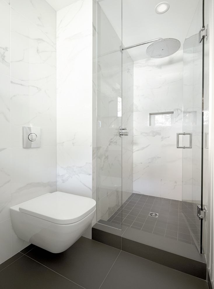This is an example of a mid-sized contemporary master bathroom in Toronto with an undermount sink, flat-panel cabinets, grey cabinets, engineered quartz benchtops, an alcove shower, a wall-mount toilet, multi-coloured tile, porcelain tile, white walls and porcelain floors.