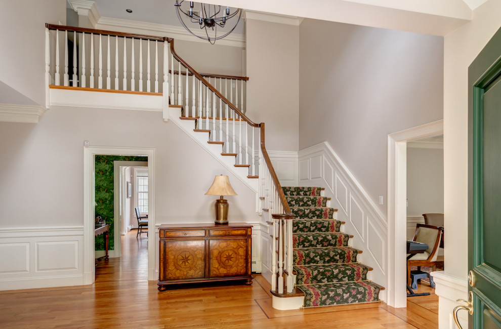 Large traditional foyer in Boston with grey walls and medium hardwood floors.