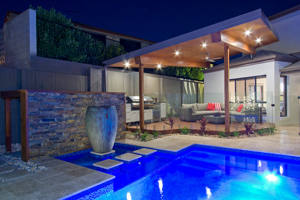 Inspiration for a mid-sized modern backyard deck in Brisbane with an outdoor kitchen and a roof extension.