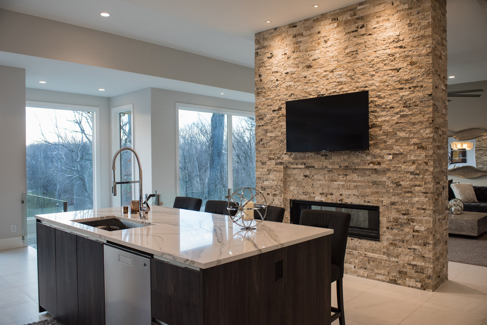Inspiration for a mid-sized modern l-shaped eat-in kitchen in Other with flat-panel cabinets, dark wood cabinets, quartzite benchtops, marble floors, with island, an undermount sink, beige splashback, stone tile splashback, stainless steel appliances and white floor.