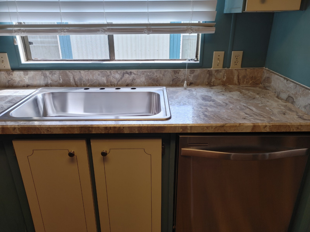 Inspiration for a mid-sized kitchen remodel with white cabinets, laminate countertops, an island and beige countertops