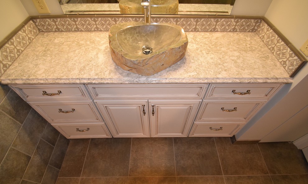 Doorless shower - small transitional master multicolored tile and ceramic tile ceramic tile doorless shower idea with raised-panel cabinets, white cabinets, a two-piece toilet, gray walls, a vessel sink and quartz countertops