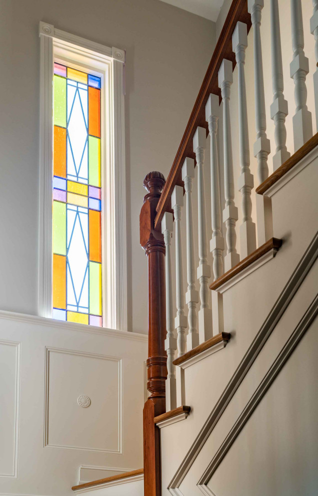 Design ideas for a victorian wood wood railing staircase in Boston with painted wood risers.
