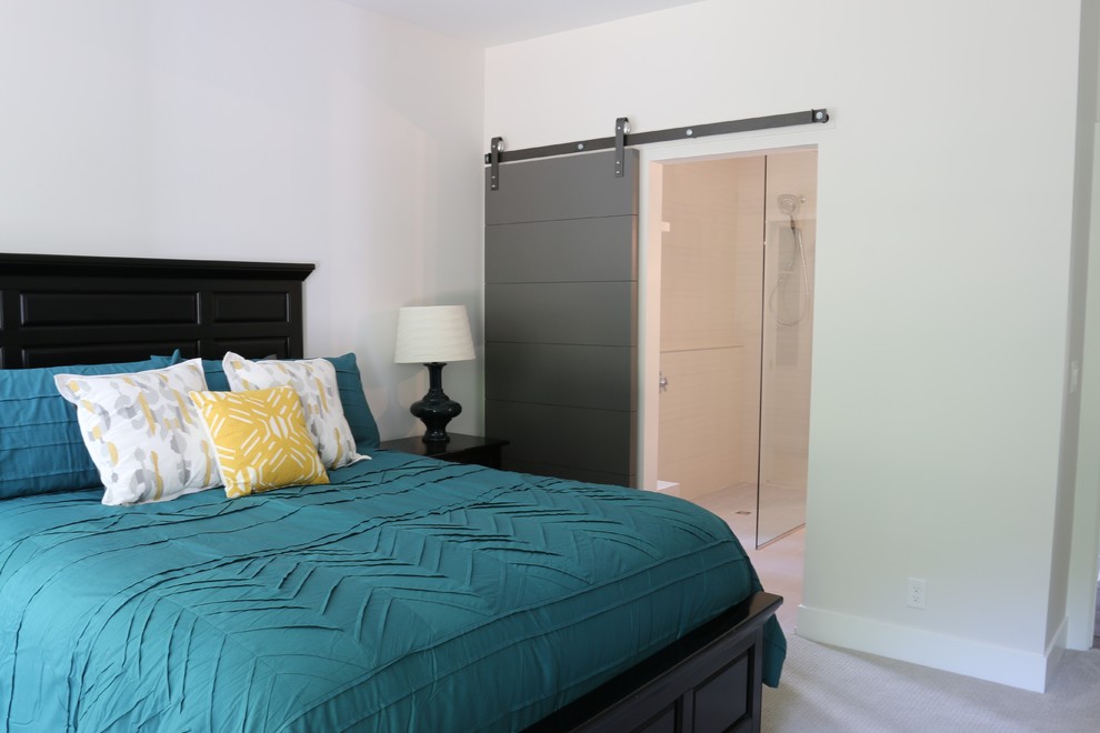 Example of a mid-sized transitional master carpeted bedroom design in Grand Rapids with white walls and no fireplace